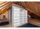 Spacious unfinished attic with exposed beams, open shelves, and easy access from the main house at 404 Settlecroft Ln, Holly Springs, NC 27540