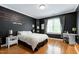 This bedroom has black walls with a quote and a zebra-patterned curtain at 404 Settlecroft Ln, Holly Springs, NC 27540