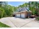 Spacious brick home with a three-car garage and well-maintained landscaping at 404 Settlecroft Ln, Holly Springs, NC 27540