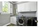 Laundry room with modern washer and dryer at 404 Settlecroft Ln, Holly Springs, NC 27540