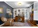 Inviting home office with custom built-ins, hardwood floors, and abundant natural light at 404 Settlecroft Ln, Holly Springs, NC 27540