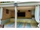 Outdoor patio with brick wall, speakers, TV and indoor/outdoor rugs at 404 Settlecroft Ln, Holly Springs, NC 27540