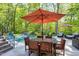 Stunning in-ground pool and patio featuring an outdoor dining set and lush landscaping at 404 Settlecroft Ln, Holly Springs, NC 27540