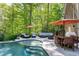 Stunning in-ground pool with a spacious patio, perfect for outdoor entertaining and relaxation at 404 Settlecroft Ln, Holly Springs, NC 27540