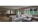 Spacious game room features a pool table and comfortable seating area with natural light at 404 Shinleaf Pond Trl, Raleigh, NC 27614