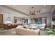 Open-concept living area with kitchen, dining, and living spaces flowing together, perfect for entertaining at 404 Shinleaf Pond Trl, Raleigh, NC 27614