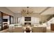 Inviting living room with fireplace, modern lighting, and seamless access to the outdoors at 404 Shinleaf Pond Trl, Raleigh, NC 27614