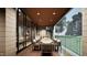 Covered outdoor dining area with seating and views at 404 Shinleaf Pond Trl, Raleigh, NC 27614