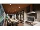 Outdoor living area with a built-in grill and dining space for outdoor entertainment at 404 Shinleaf Pond Trl, Raleigh, NC 27614
