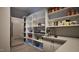 Well-organized pantry with stainless steel refrigerator, shelves, counterspace and coffee machine at 404 Shinleaf Pond Trl, Raleigh, NC 27614