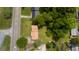 Birds eye view of a lovely home with a beautiful yard surrounded by mature trees and quiet streets at 409 Ivey Rd, Graham, NC 27253