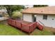 Elevated wooden deck in a lush backyard, perfect for outdoor enjoyment at 409 Ivey Rd, Graham, NC 27253