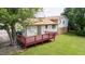 Backyard featuring a raised deck overlooking the property at 409 Ivey Rd, Graham, NC 27253
