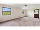 Spacious carpeted bedroom with natural light and ample space at 409 Ivey Rd, Graham, NC 27253