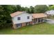 Two-story house showing brick and vinyl siding and a well manicured lawn at 409 Ivey Rd, Graham, NC 27253