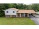 Aerial view of a two-story home with a green lawn at 409 Ivey Rd, Graham, NC 27253