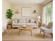 Bright living room with neutral tones, natural light, and modern furniture at 409 Ivey Rd, Graham, NC 27253