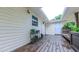 Covered back porch featuring wood floors, flower decor, and a bench at 41 Maple Cir, Pittsboro, NC 27312