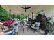 Spacious, covered patio with comfortable seating, ceiling fans, and garden views at 41 Maple Cir, Pittsboro, NC 27312