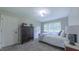 Cozy bedroom with comfortable furnishings and great natural light from the window at 41 Maple Cir, Pittsboro, NC 27312