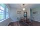 Cozy dining room featuring a round table, four chairs, and natural light from large windows at 41 Maple Cir, Pittsboro, NC 27312