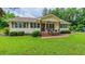 Charming single-story home with a covered front porch and well-manicured lawn at 41 Maple Cir, Pittsboro, NC 27312