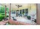 Cozy front porch with rocking chairs, a ceiling fan, and decorative plants at 41 Maple Cir, Pittsboro, NC 27312