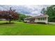 Beautiful single-story home with lush green lawn and a welcoming front porch at 41 Maple Cir, Pittsboro, NC 27312