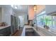 Kitchen sink and large window with stainless appliances, white countertops and hardwood floors at 41 Maple Cir, Pittsboro, NC 27312