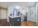 Charming kitchen with white cabinetry, a dark blue island, and stainless steel appliances at 41 Maple Cir, Pittsboro, NC 27312