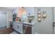 Bright kitchen with white cabinets, stainless steel appliances, and a window over the sink at 41 Maple Cir, Pittsboro, NC 27312
