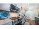 Modern kitchen featuring stainless steel appliances, white cabinets, and marble countertops at 41 Maple Cir, Pittsboro, NC 27312