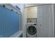 Laundry closet featuring a front-loading washing machine at 41 Maple Cir, Pittsboro, NC 27312