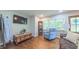 Cozy living room boasts hardwood floors, a large TV, and a curio cabinet at 41 Maple Cir, Pittsboro, NC 27312