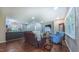 Open-concept living room with hardwood floors, view to the kitchen, and plenty of natural light at 41 Maple Cir, Pittsboro, NC 27312