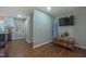 Living room view features hardwood floors, TV, trunk, and an attached Kitchen view at 41 Maple Cir, Pittsboro, NC 27312
