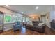 Comfortable living room with hardwood floors, lots of windows, and a cozy seating arrangement at 41 Maple Cir, Pittsboro, NC 27312