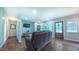 Inviting living room features hardwood floors, a comfortable recliner, and lots of natural light at 41 Maple Cir, Pittsboro, NC 27312