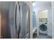 View of refrigerator and mudroom with laundry closet at 41 Maple Cir, Pittsboro, NC 27312