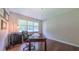 Office space with a desk, chair, wood flooring, a printer and diplomas on the wall at 41 Maple Cir, Pittsboro, NC 27312