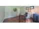Office space with a desk, chair, wood flooring, and diplomas on the wall at 41 Maple Cir, Pittsboro, NC 27312