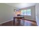 Office space with a desk, chair, wood flooring, and natural light from a window at 41 Maple Cir, Pittsboro, NC 27312