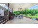 Covered patio featuring an outdoor dining table and chairs set; perfect for entertaining and relaxation at 41 Maple Cir, Pittsboro, NC 27312