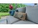 Comfortable outdoor couch with decorative pillows on a covered patio at 41 Maple Cir, Pittsboro, NC 27312