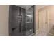 Modern tiled shower with glass door, convenient niche, and stylish fixtures at 41 Maple Cir, Pittsboro, NC 27312