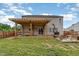 Well-kept backyard with a large pergola, a wooden fence and ample seating at 412 Collington Dr, Mebane, NC 27302