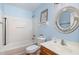 Cozy bathroom with bathtub, shower, single sink vanity, decorative mirror, and themed decorations at 412 Collington Dr, Mebane, NC 27302