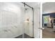 New bathroom featuring a glass shower door and clean marble style tile at 412 Collington Dr, Mebane, NC 27302