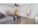Main bedroom featuring neutral walls and carpet floors, with ensuite bathroom and walk-in closet at 412 Collington Dr, Mebane, NC 27302