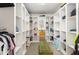 Spacious walk-in closet featuring a carpet and custom shelving at 412 Collington Dr, Mebane, NC 27302